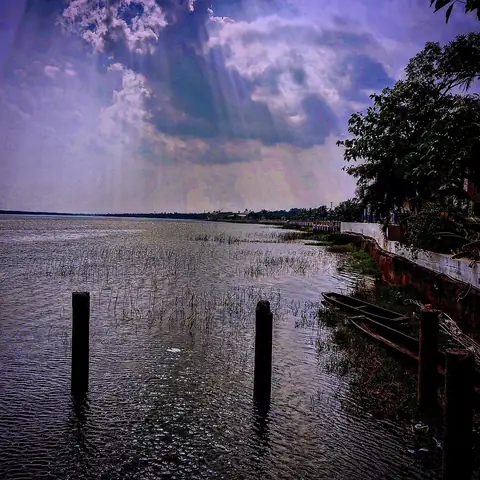 Posts, Boats and Sun Rays, India
